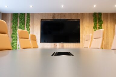 Modern corporate boardroom interior design with large meeting table
