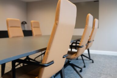 Modern corporate boardroom interior design with large meeting table