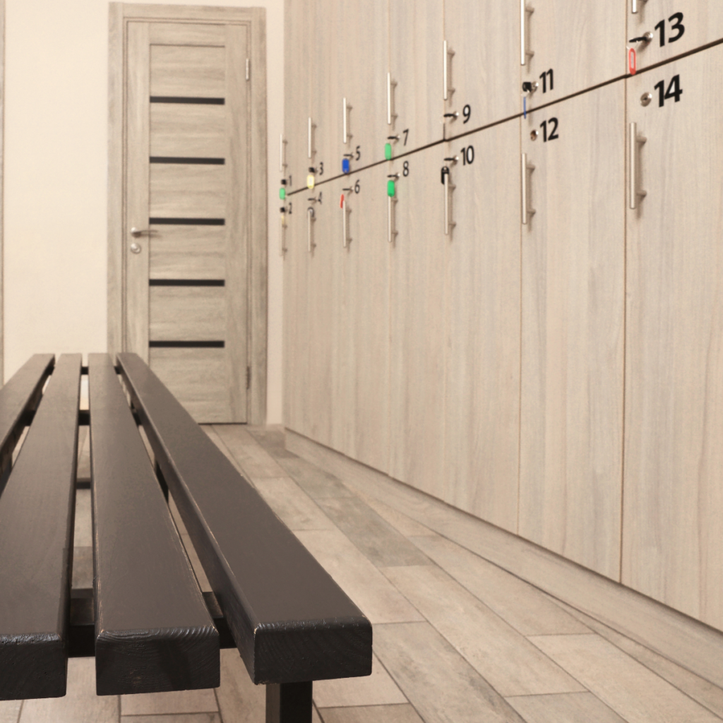 light cream wood changing room with black bench