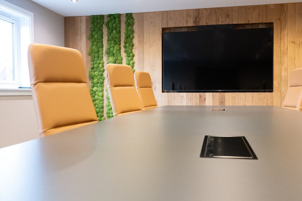 Modern corporate boardroom interior design with large meeting table