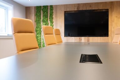 Modern corporate boardroom interior design with large meeting table
